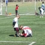Thoughtful kid ties opponent’s shoe during youth match
